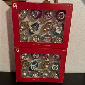 Two sets of 12 place and time glass ornaments